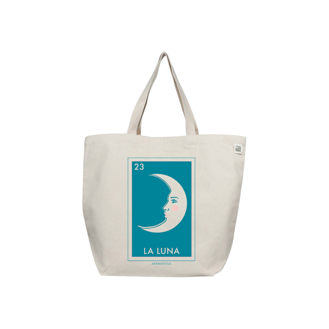 A natural cotton extra large tote bag with a graphic print of a crescent moon and the text '23 LA LUNA' in a teal blue rectangle on the front.