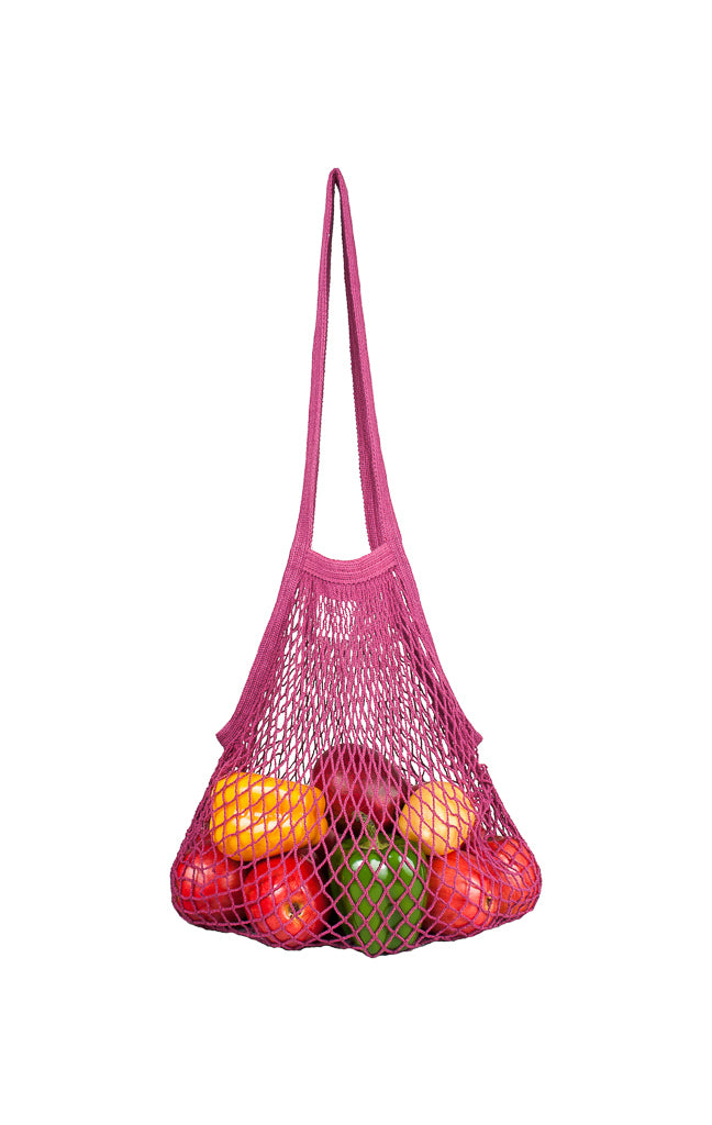 Fuchsia colored long handle string bag with produce